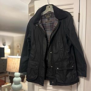 Women’s Barbour wax coat with lined black vest.